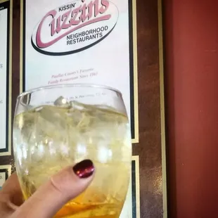  hand holding a glass of drink