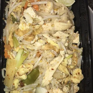 chicken and vegetables in a black container