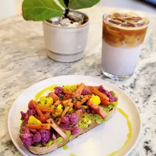 Avocado Garden Toast: country loaf topped w/ cherry tomato, pickled veggies, chives &amp; a drizzle of cilantro infused olive oil