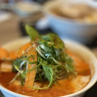 a bowl of ramen and a bowl of soup