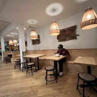 a man sitting at a table in a restaurant