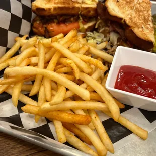 Fries on the side of sourdough club.