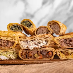 a pile of meat and cheese pastries