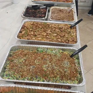 Veggies, unicorn rice, pancit with tofu, soy roasted chicken, chicken adobo, beef calderetta, and Lechon.