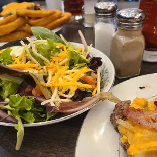 The Bob Burger (bun set aside), side salad, and husband's onion rings in the background.