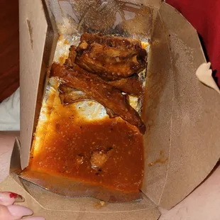 Dry, hard, overcooked ribs NOT tossed in hot garlic but drowning in it. Very disgusting. Went in the garbage.