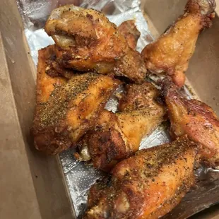 Dry-rub lemon pepper wings - lots of pepper, no lemon, chewy skin, and red inside on a few