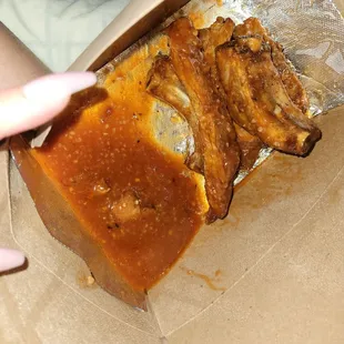 A pool of sauce, ruined the flavor. Just dry hard meat with a TON hot and garlic sauce.