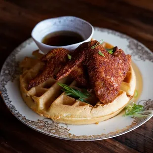 {Chicken n' Waffle}
Two whole damn wings served over waffle with bourbon syrup.