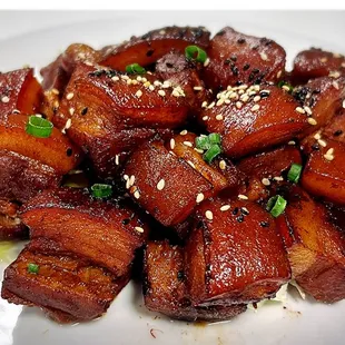 Caramelized pork belly. 1 lb portion. 

Chinese called 紅燒肉 braised over 60mins until the juicy dry and turn caramelized.