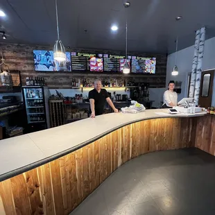 two people standing at the counter