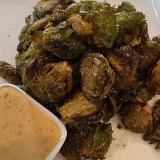 crispy spiced brussels sprouts with aleppo aioli sauce