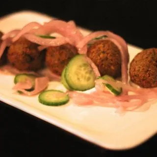 falafel patties with haydari, persian cucumber, pickled fennel onions