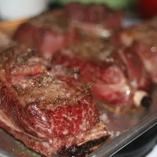 steaks on a baking sheet