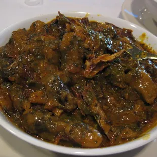 Ekwang (consisting of tubes of cocoyam wrapped in leaves and served in an ooze of spices, seasonings, and dried fish)
