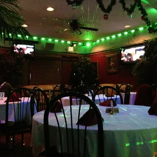 a dining room with green lights