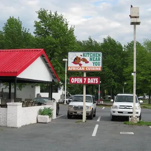 the restaurant, signboard, and parking lot on the northbound side of Ager Rd.