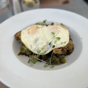 BREAKFAST BOWL Brussels sprouts, sweet potato, house bacon, kale-pistachio pesto, avocado, sunny side up eggs