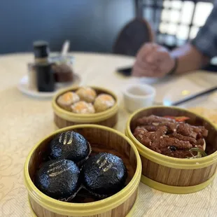 three bowls of food on a table