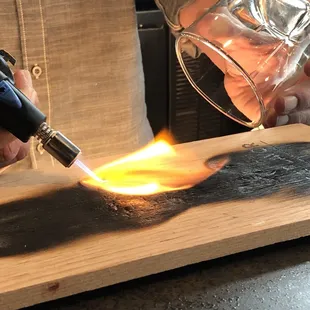 Preparation of the Smoked Maple Old Fashioned.