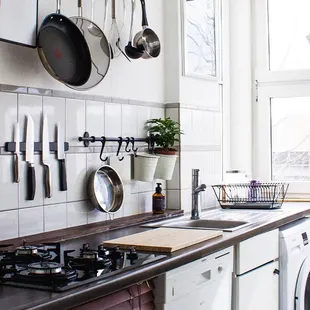 pots and pans hanging on the wall