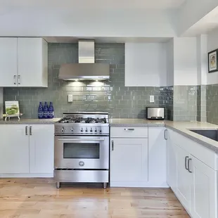 a clean kitchen with stainless steel appliances
