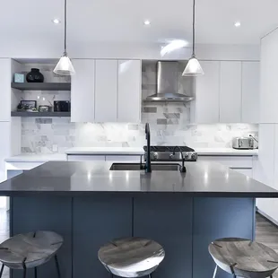 a modern kitchen with stainless steel appliances