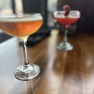 two cocktails on a table