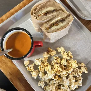 The Molly Grilled Cheese and Tomato Soup paired with their signature popcorn.