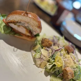 Chicken, buffalo sandwich and Caesar salad