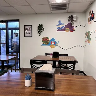 a dining room with a table and chairs