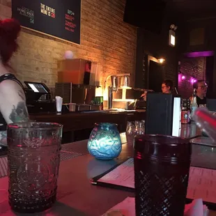 a woman sitting at a bar