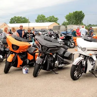 motorcycles parked in a parking lot