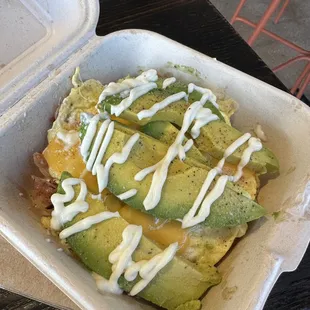 Breaky hashbrown box with scrambled egg, cheddar cheese, bacon and avocado with mayo