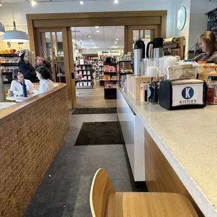 View into the book store from seated at the bar area
