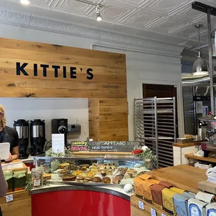 a woman standing in front of the counter