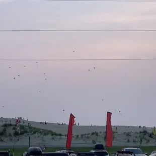 Kite flying across the street on the beach. Buy a kite and fly it .