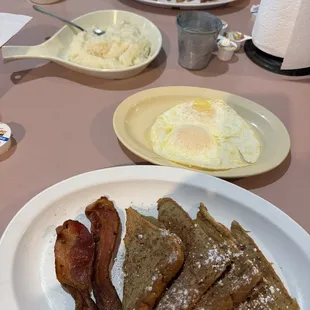 Breakfast-French toast w/bacon. Added eggs, hubby added grits. 12.2.23