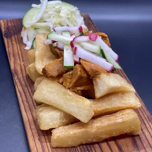 a plate of french fries and pickles