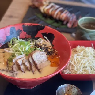 a bowl of ramen with meat and vegetables