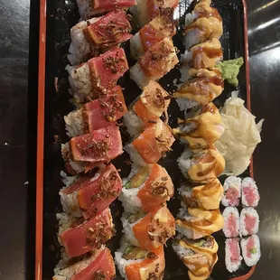 From left to right: Salmon tataki roll, salmon lovers, hang ten, and negi toro.