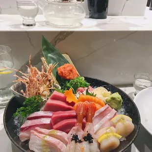 Back: Spicy tuna / toro, amaebi, wakame. Middle: chūtoro, sake, hamachi, otoro, kanpachi. Front: albacore, amaebi, hotategai.