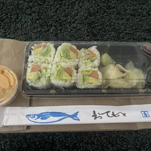 Salmon Avocado Roll... so tiny. Sauce is larger lol