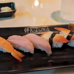 Nigiri shrimp, yellow tail tuna, red clam, and tofu wrapper