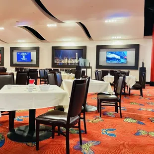 a dining room with tables and chairs