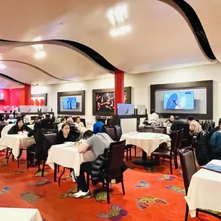 a restaurant with tables and chairs