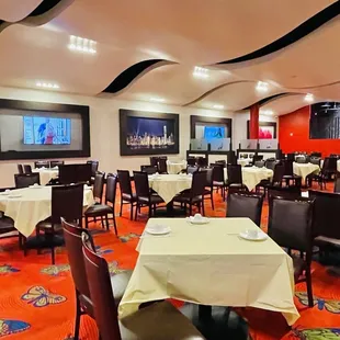 a restaurant with tables and chairs