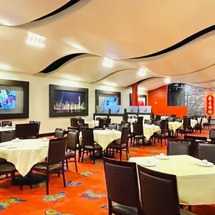 a restaurant with tables and chairs
