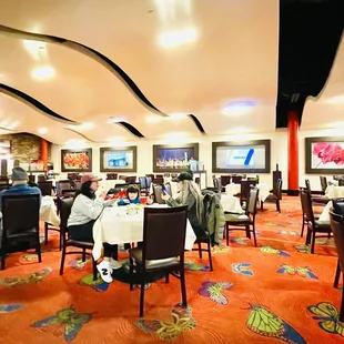 a restaurant with people sitting at tables