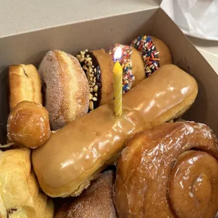 Cinnamon Roll, Sugar Twist, Maple bar, Chocolate, Donut Hole, Sugar, Chocolate w/Peanuts, vanilla &amp; chocolate w/rainbow sprinkles